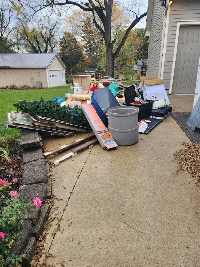 Dumpster being loaded with debris for 3 Yard Dumpster Rental in Frankstown